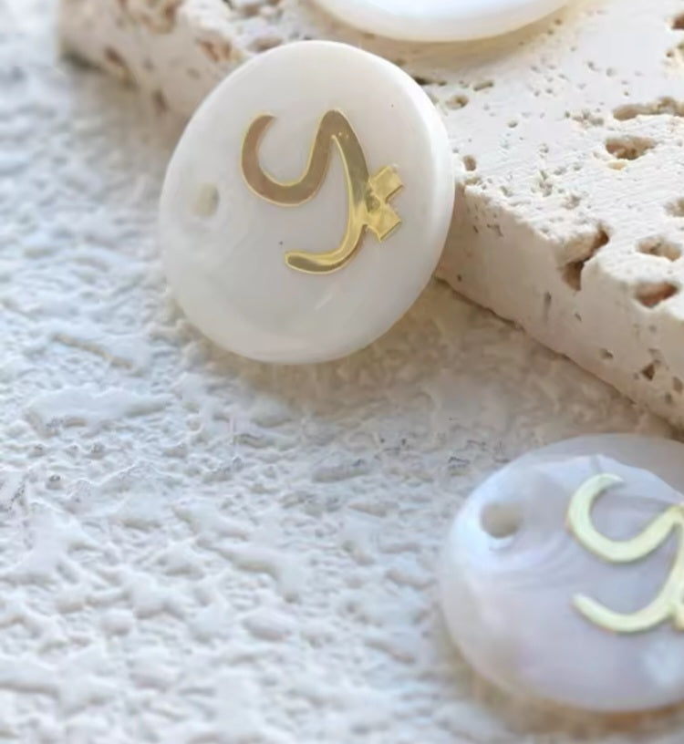 Arabic letters charm on shells