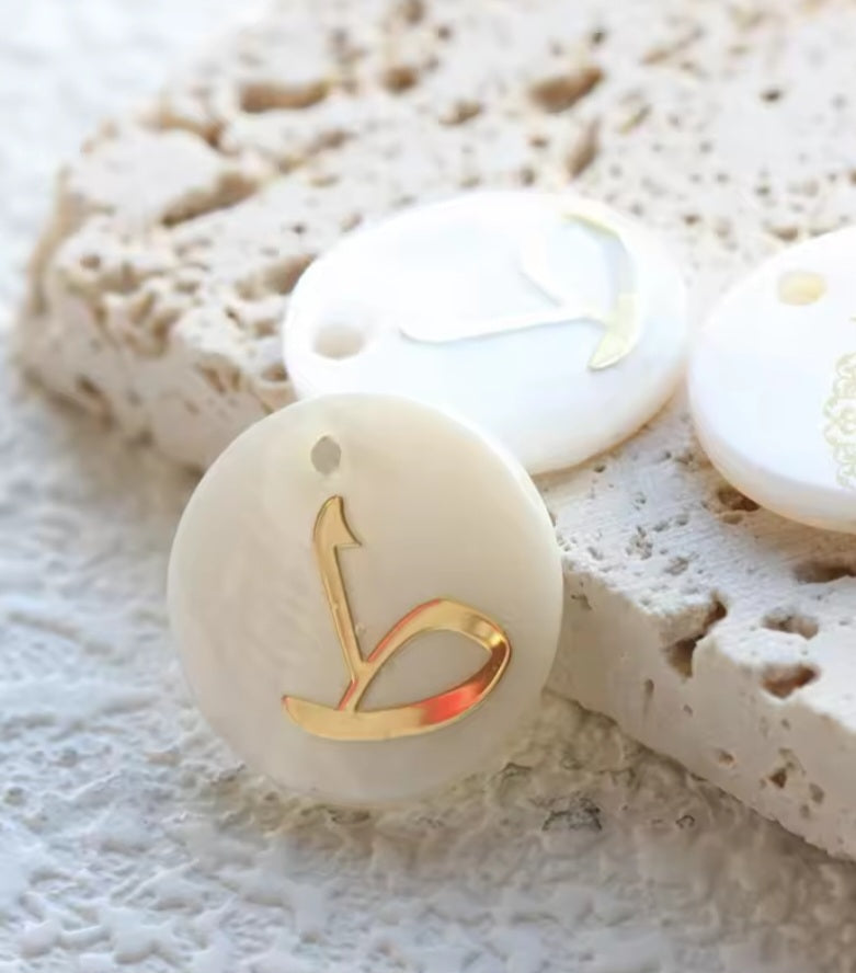 Arabic letters charm on shells